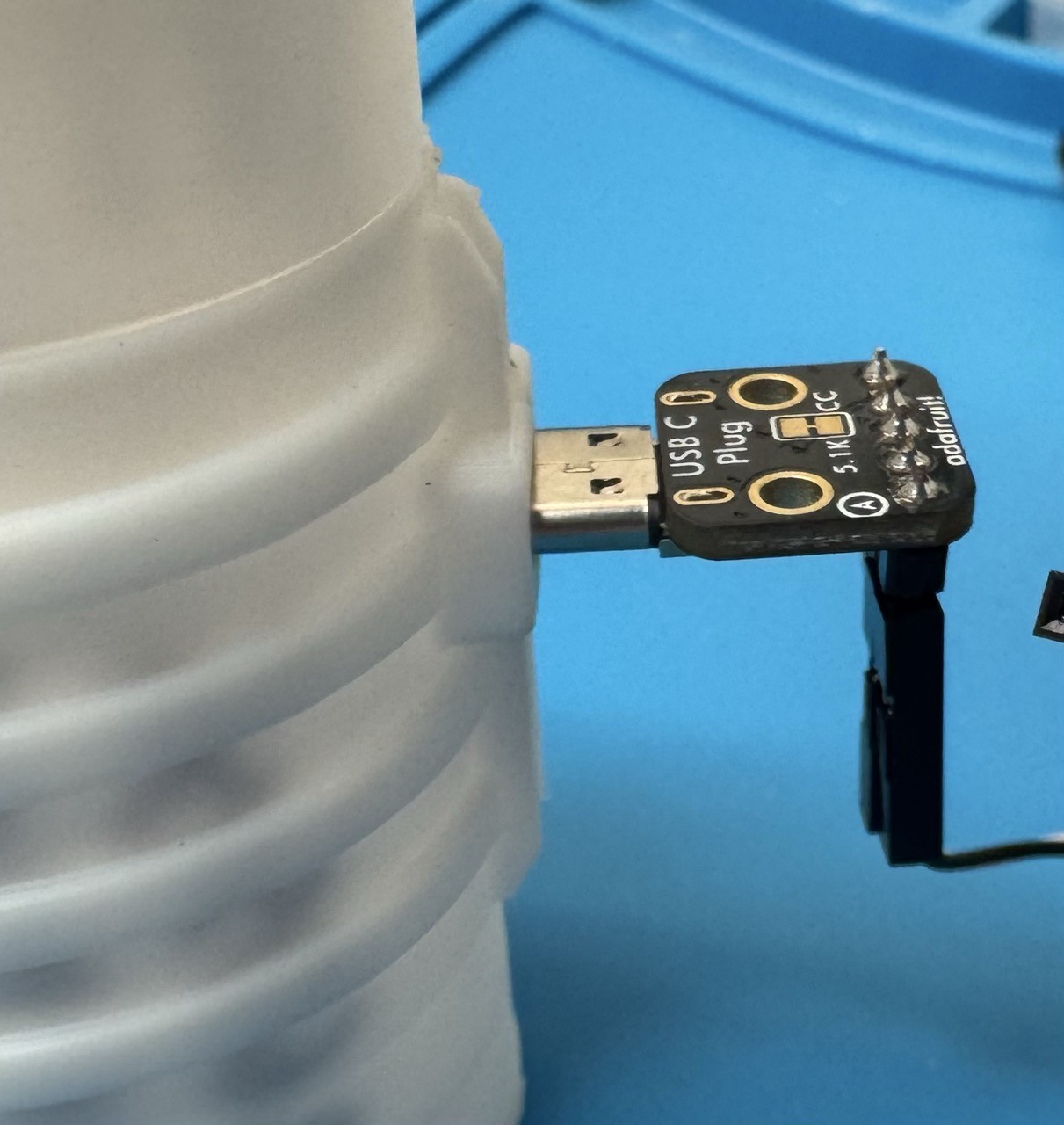 USB-C breakout board connected to an assembled device in its case