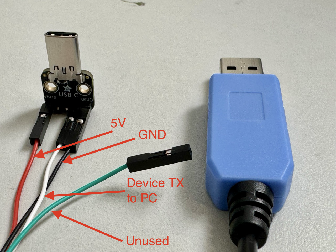 Diagnostic cable showing the 5 V, ground, serial-data, and unused leads